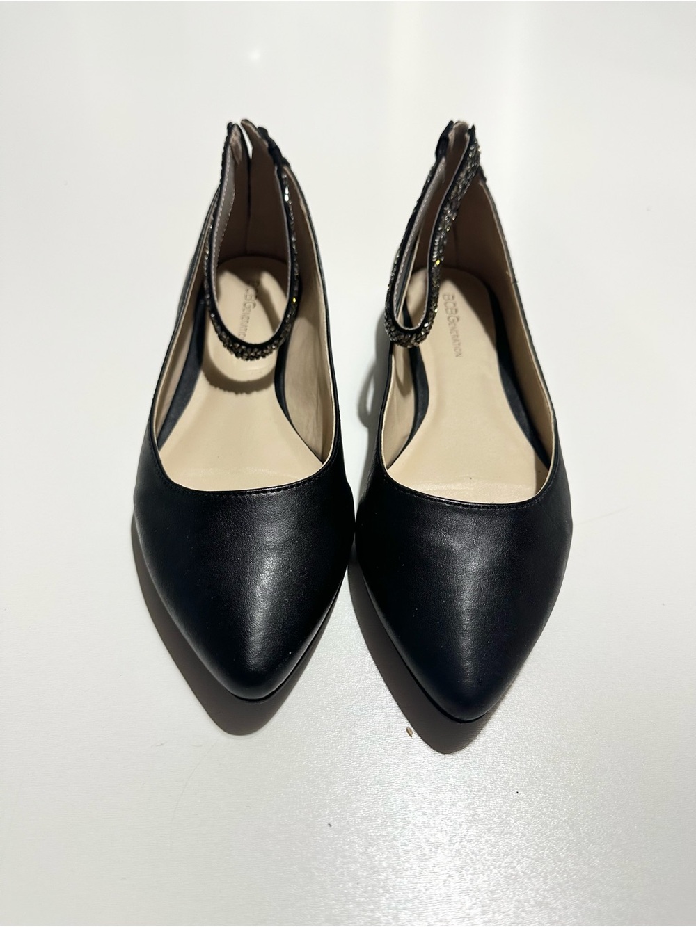 BCBGeneration Black Pointed Toe Slingback Flats with Embellished Ankle Strap